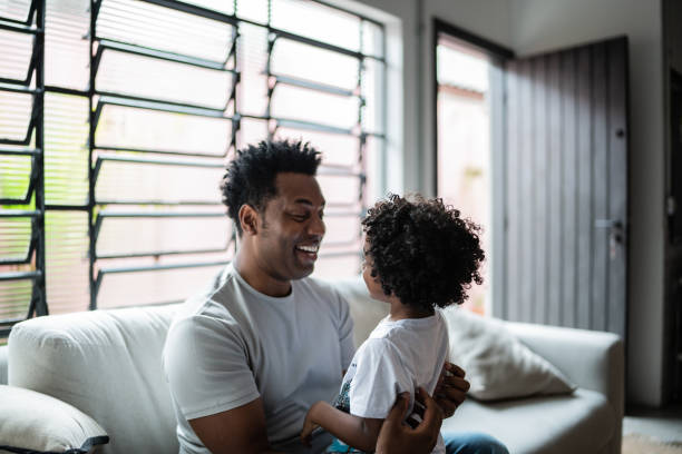 istock Bonding moment between father and son at home 1390901131