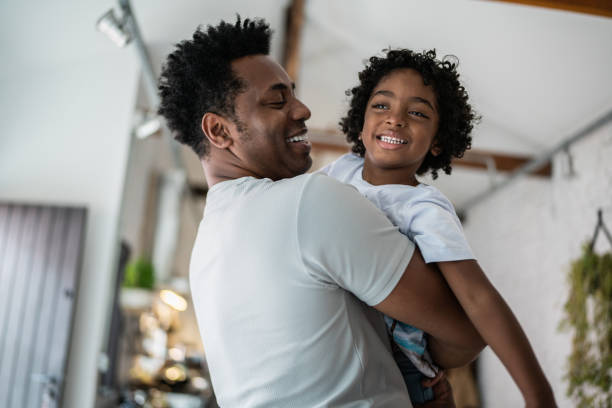 istock Bonding moment between father and son at home 1390901146