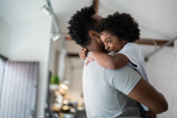 istock Bonding moment between father and son at home 1390901159