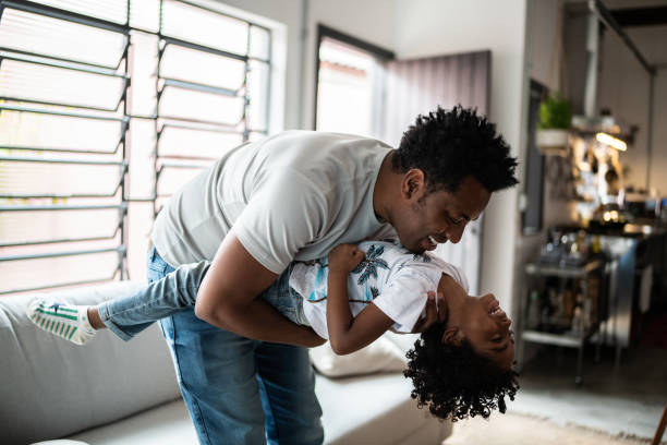 istock Happy father and son playing at home 1390901160
