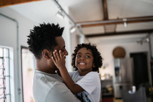 istock Bonding moment between father and son at home 1390901163