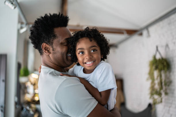 istock Bonding moment between father and son at home 1390901171