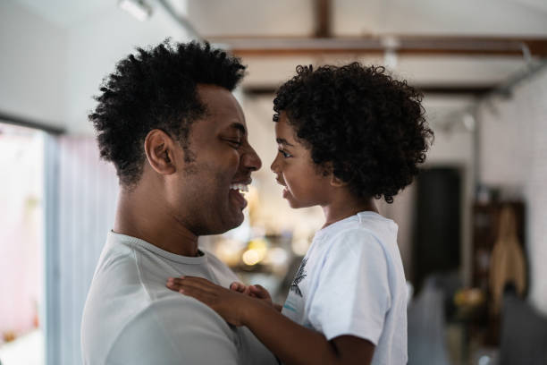 istock Bonding moment between father and son at home 1390901195