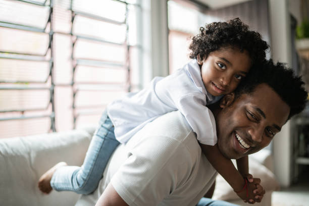 istock Happy father and son playing at home 1390901233