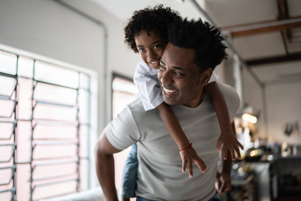 istock Happy father and son playing at home 1390901256