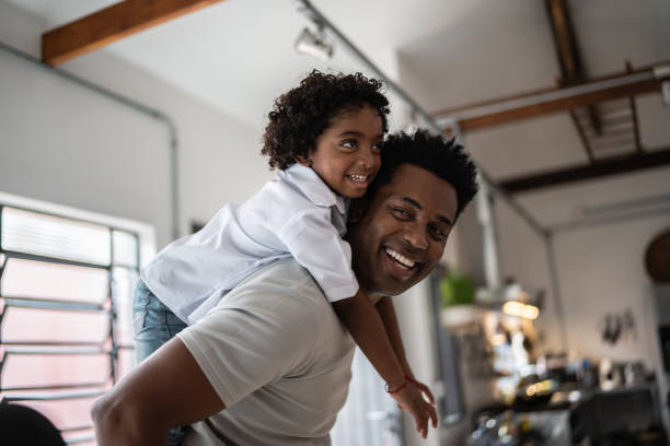 istock Happy father and son playing at home 1390901262