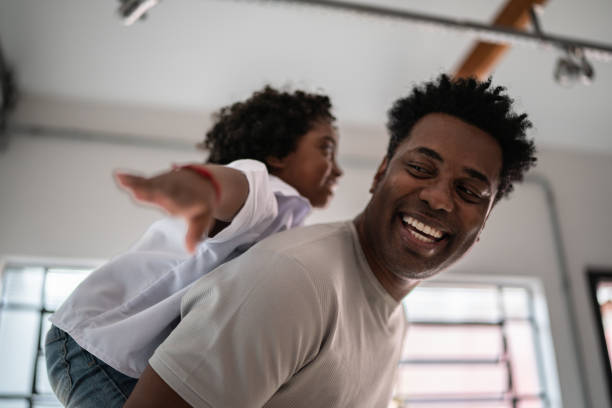 istock Happy father and son playing at home 1390901272
