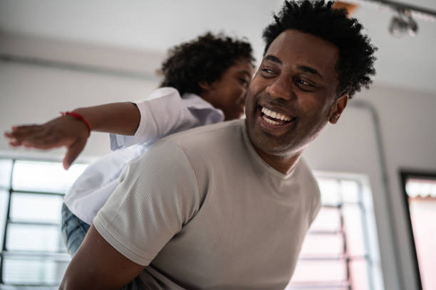 istock Happy father and son playing at home 1390901284