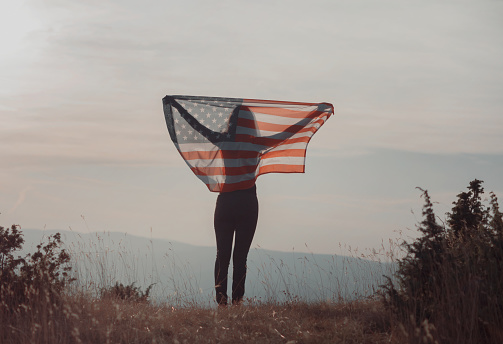 Female with American flag outdoor