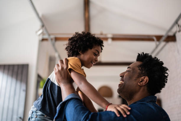 istock Father and son playing at home 1390901899
