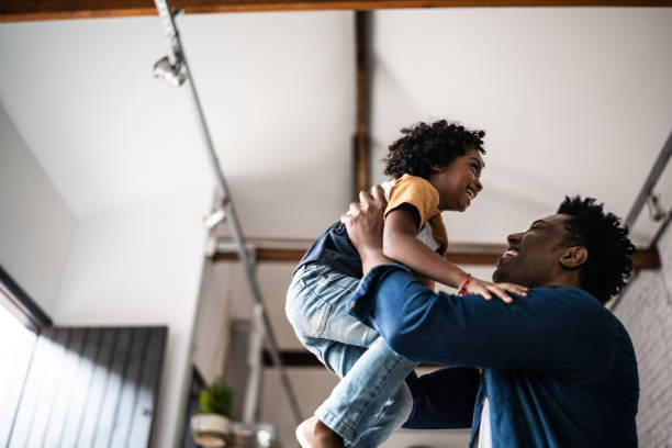 istock Father and son playing at home 1390901971