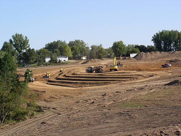 New Real Estate Subdevelopment A hillside is transformed by large equipment into a upscale housing development. New houses have nice view of canyon to left. Curved terraces add visual interest. subdevelopment stock pictures, royalty-free photos & images