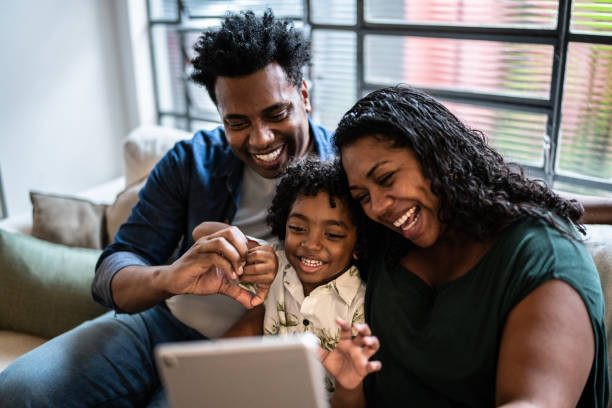 istock Family doing a video call using digital tablet at home 1390903034