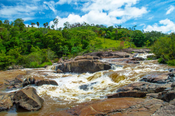 istock Beautiful landscape with waterfall, blue sky, trees, rivers, mountains and clouds. 1390903116