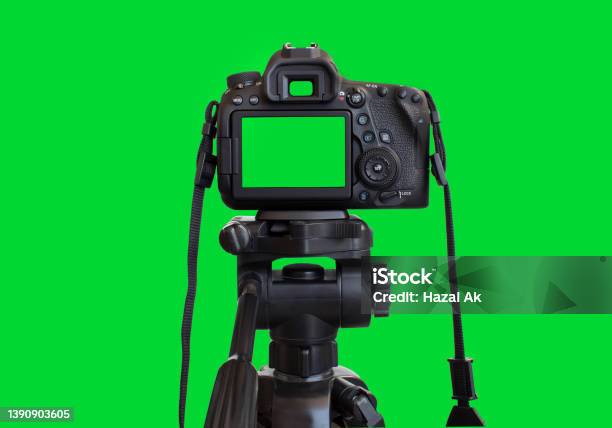 Dslr Camera With Empty Screen On The Tripod Isolated On Green Background Green Screen Camera Stock Photo - Download Image Now