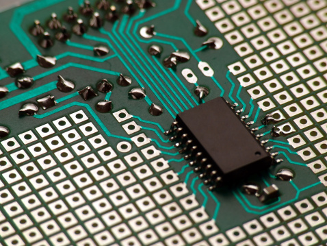 A closeup of a microcontroller on a development board.