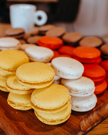 Background formed with stacked colorful macarons, Beautiful Multicolored Macarons, macarons served to the table