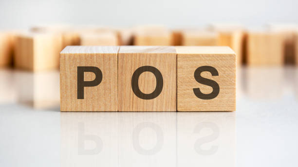 istock pos - letters on wooden cubes. business as usual concept image. front view 1390904532