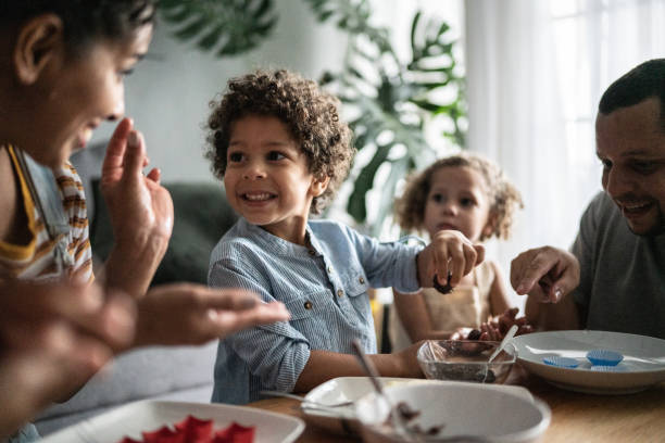 istock Family preparing chocolate at home 1390904748