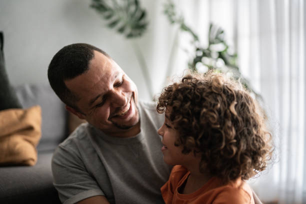 istock Father and son embracing at home 1390905056