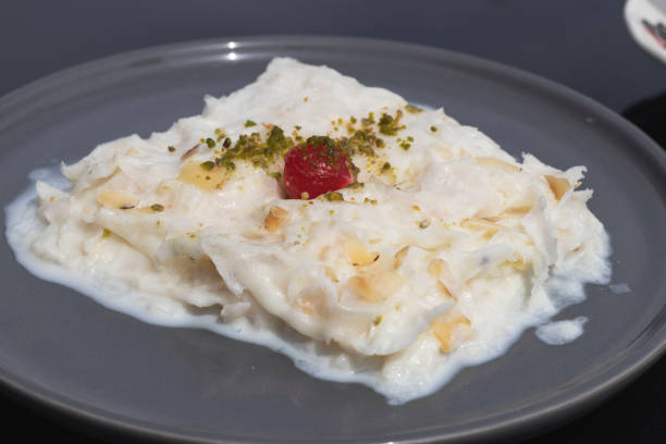 istock Close-up walnut gullac dessert. Traditional Ramadan dessert. Middle Eastern desserts 1390905073