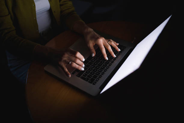 istock Woman doing a browser search on her laptop late at night 1390905795