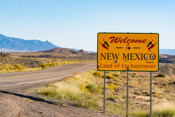Teec Nos Pos, AZ - October 10,2021:  Welcome to New Mexico sign along the road at the state border in Teec Nos Pos, Arizona