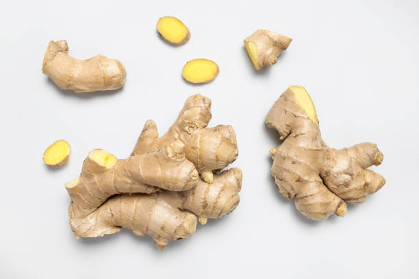 istock Fresh ginger root on light gray background top view flat lay. Spice for cooking, herbal tea with ginger to boost immunity. Natural organic ginger for health, medicine, protection against colds 1390909479