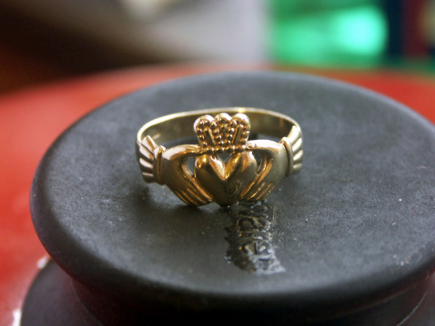 Claddagh Ring taken off to do the washing up. On the ring, the tow hands represent friendship, the heart represents love and the crown represents loyalty.