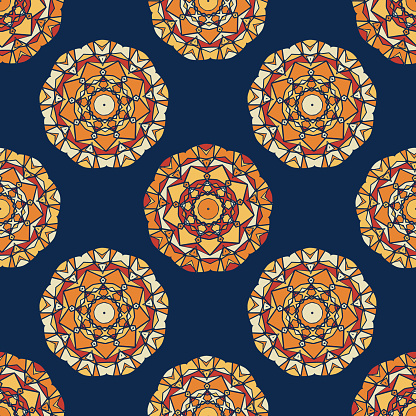 Seamless vector pattern of bright colorful geometric round ethnic decorative elements in the form of a mosaic. Vector mandala background with oriental, floral motifs.