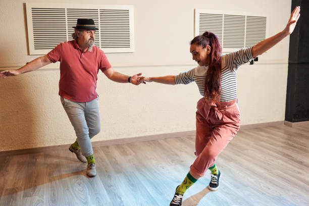 istock Lindy Hop teachers giving classes in a dance studio 1390910509