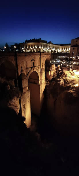 istock Famous Ronda roman bridge at night 1390910643