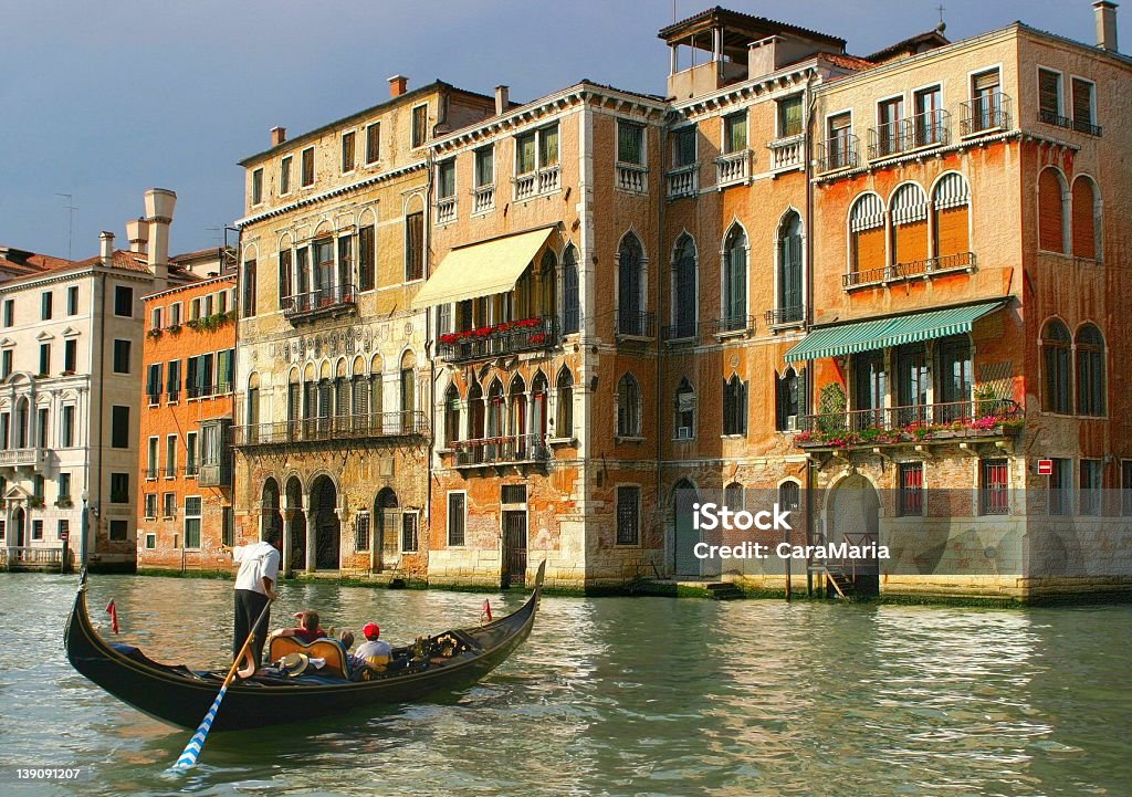 Gondolier Canal in venice Canal Stock Photo