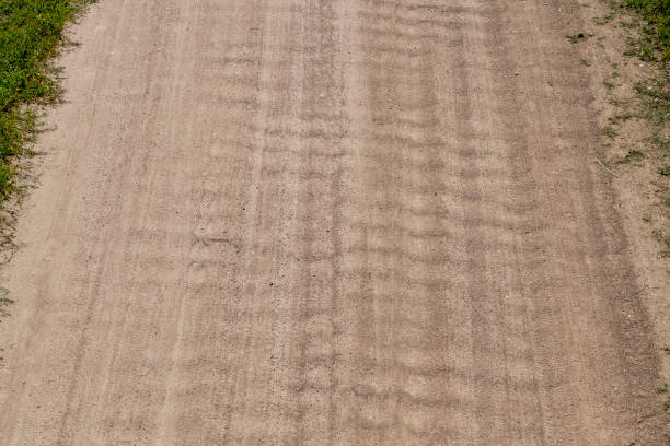 istock features on paved sandy road in rural area 1390912557