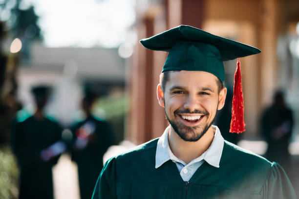 istock Portrait of happy graduate student looking at camera. 1390915251