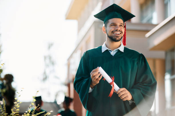 istock Happy graduate student with a certificate after graduation ceremony at the university. 1390915270