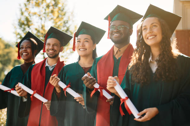 istock Multiracial group of happy students on their graduation day. 1390915432