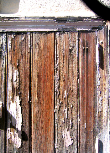 Old weathered painted wood door.