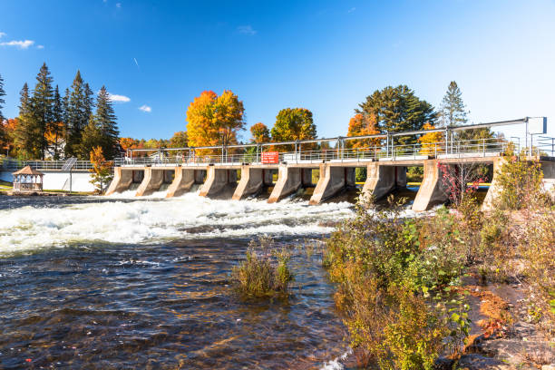 istock Small dam under blue sky in autumn 1390918454