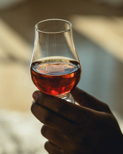 istock holding whiskey in a glass 1390921436