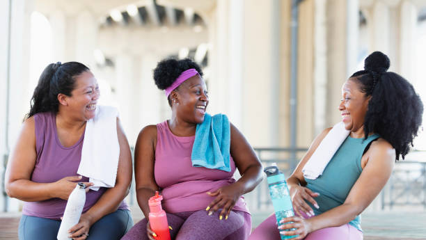 istock Three multiracial women conversing after exercise 1390921860