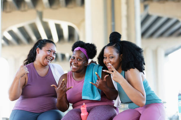 istock Three multiracial women sit together after workout 1390922393