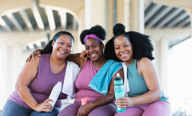 istock Three multiracial women sit together after workout 1390922394