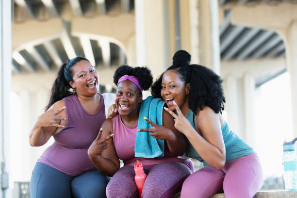 istock Three multiracial women sit together after workout 1390922419