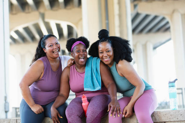 istock Three multiracial women sit together after workout 1390922430