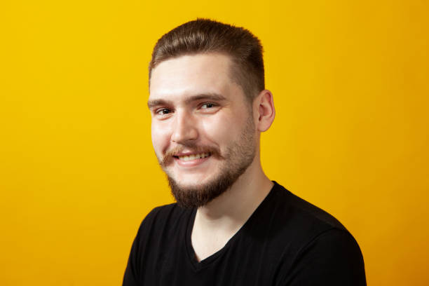 istock Studio portrait of a 22 year old bearded man 1390925867