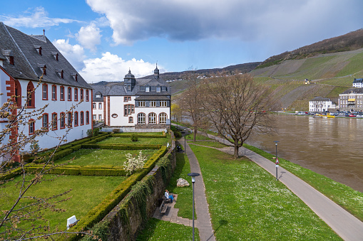 Bernkastel-Kues, Germany, April 2022 : St. Nicholas' Hospital (Cusanus Foundation) on the banks of Mosel River