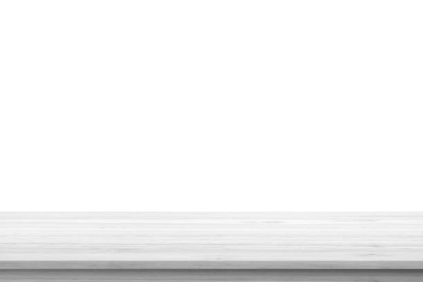 istock Empty white wooden table top isolated on white background 1390935065