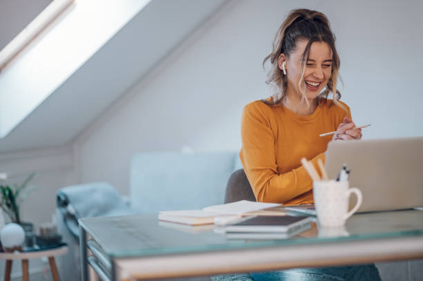 istock Woman having web call on a laptop while working at home 1390936198