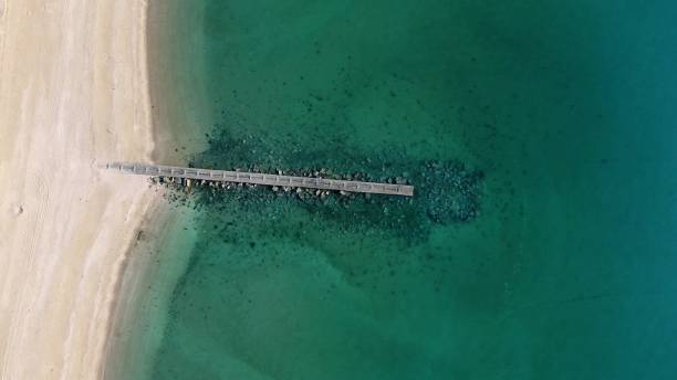 istock Light green sea water on the coast 1390937156